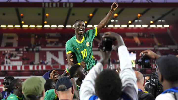 Senegal's midfielder #10 Cheikh Sabaly celebrates after scoring his team's third goal during the international friendly football match between England and Senegal.